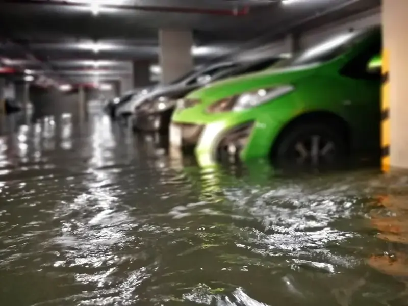 Storm runoff flooding a garage floor after heavy rain